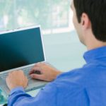man on computer